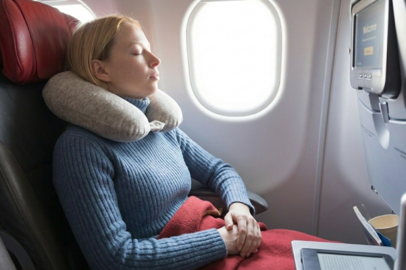 7 Tips for Sleeping Better on a Plane, According to Flight Attendants